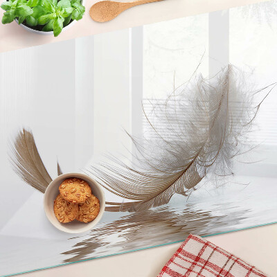 Planche à découper verre Une plume contre l'eau