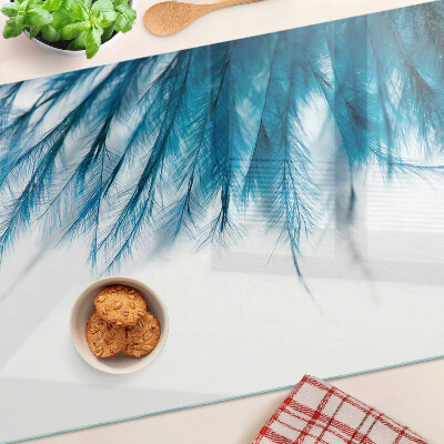 Planche à découper en verre Plumes bleues sur fond blanc