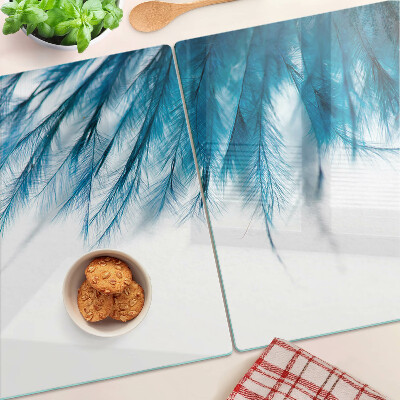 Planche à découper en verre Plumes bleues sur fond blanc