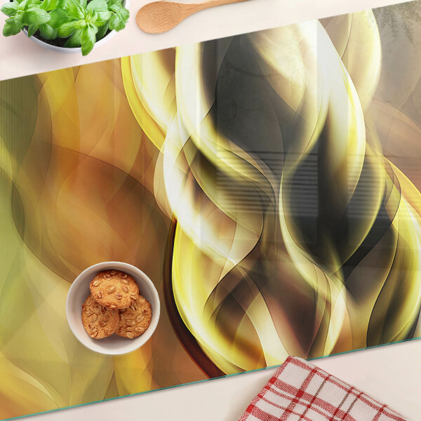 Planche à découper en verre Vagues abstraites dans des tons dorés