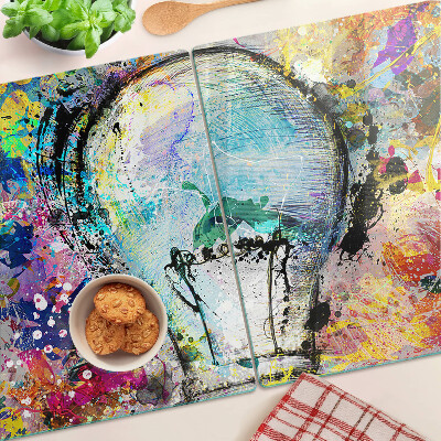 Planche à découper en verre Ampoule sur fond coloré