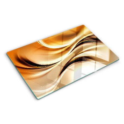 Planche à découper en verre Vagues abstraites dans des tons dorés