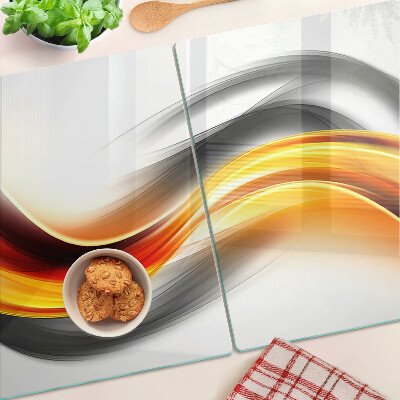 Planche à découper en verre Vagues en orange et noir