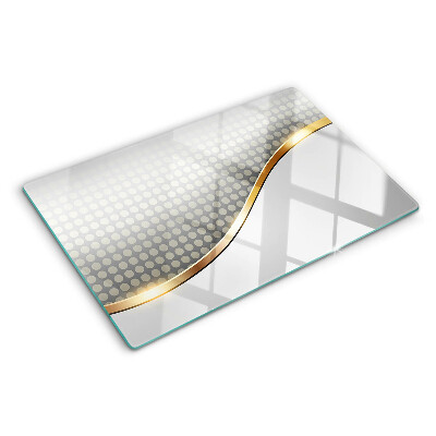 Planche à découper en verre Une vague dorée sur un fond de points