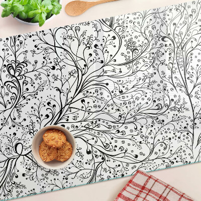 Planche à découper en verre Un motif végétal aux branches délicates