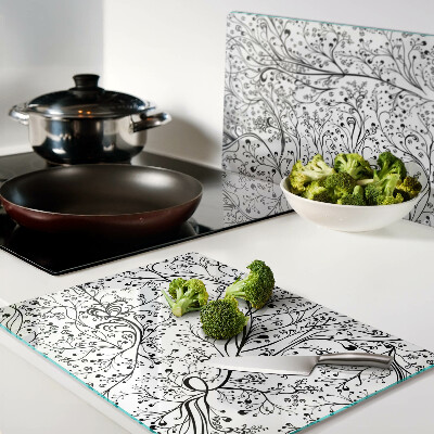 Planche à découper en verre Un motif végétal aux branches délicates