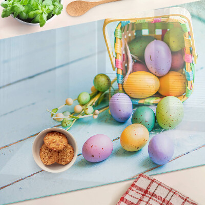 Planche à découper en verre Oeufs de Pâques colorés dans un panier