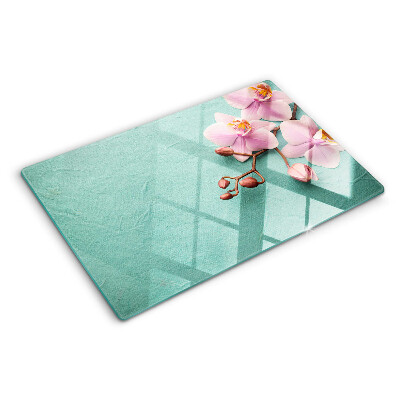 Planche à découper verre Orchidées sur fond bleu