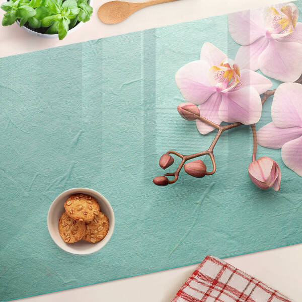 Planche à découper verre Orchidées sur fond bleu