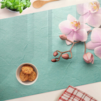 Planche à découper verre Orchidées sur fond bleu