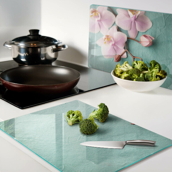 Planche à découper verre Orchidées sur fond bleu