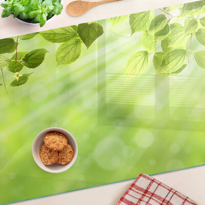 Planche à découper en verre Feuilles vertes contre la lumière