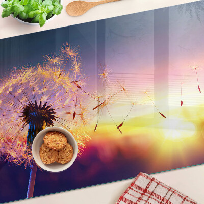 Planche à découper verre Pissenlits sur fond de coucher de soleil