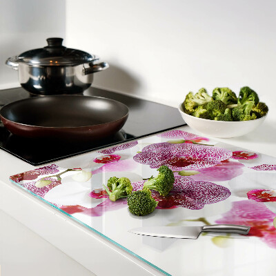 Planche à découper en verre Orchidées en arrière-plan de la fenêtre