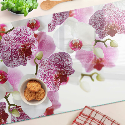 Planche à découper en verre Orchidées en arrière-plan de la fenêtre