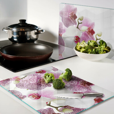 Planche à découper en verre Orchidées en arrière-plan de la fenêtre