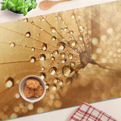 Planche à découper verre Gouttes d'eau sur un pissenlit