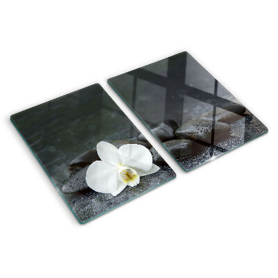 Planche à découper en verre Fleur d'orchidée sur pierres