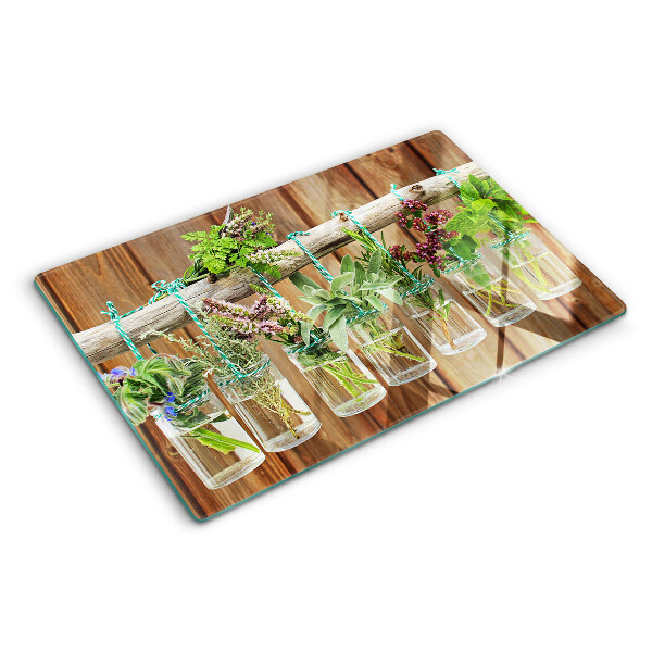 Planche à découper en verre Herbes en pots sur fond de bois