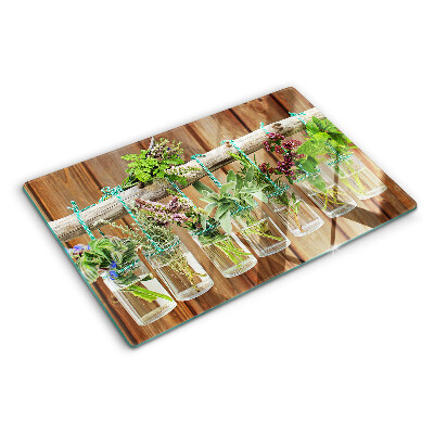 Planche à découper en verre Herbes en pots sur fond de bois