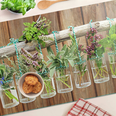 Planche à découper en verre Herbes en pots sur fond de bois