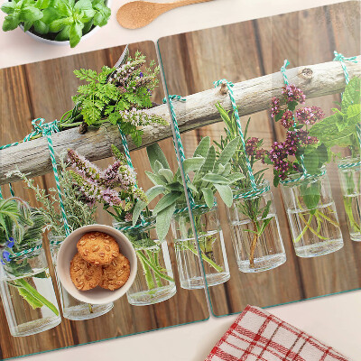 Planche à découper en verre Herbes en pots sur fond de bois