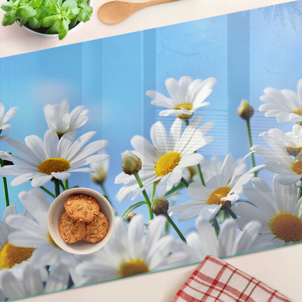Planche à découper en verre Fleurs de marguerite sur fond bleu