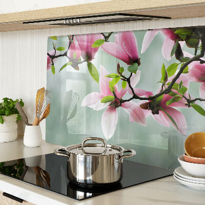 Planche à découper en verre Fleurs de magnolia sur fond de verdure