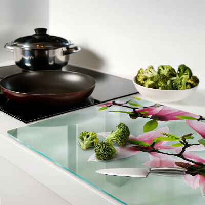 Planche à découper en verre Fleurs de magnolia sur fond de verdure