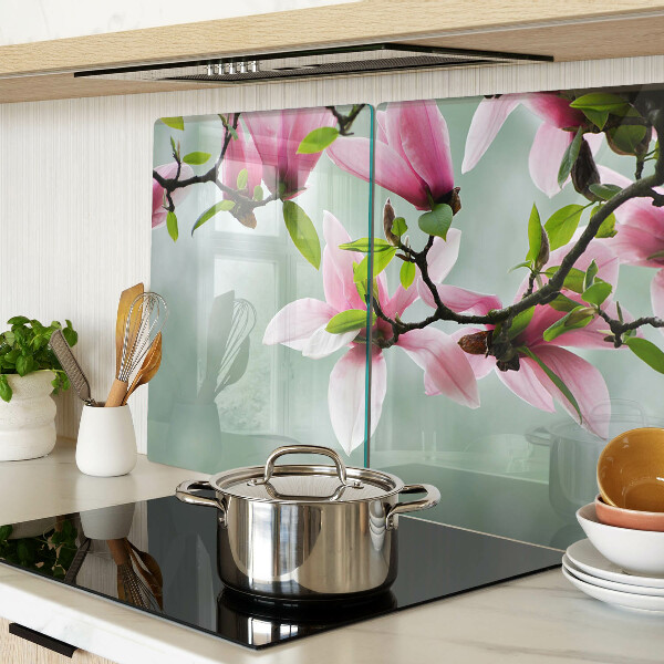 Planche à découper en verre Fleurs de magnolia sur fond de verdure
