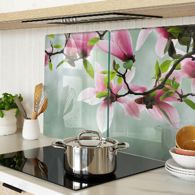 Planche à découper en verre Fleurs de magnolia sur fond de verdure