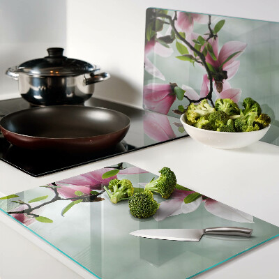 Planche à découper en verre Fleurs de magnolia sur fond de verdure