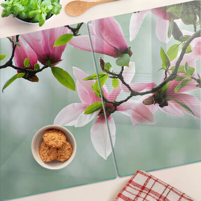Planche à découper en verre Fleurs de magnolia sur fond de verdure