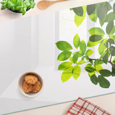Planche à découper verre Feuilles contre un ciel lumineux