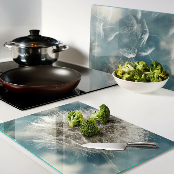 Planche à découper verre Pissenlits contre le ciel