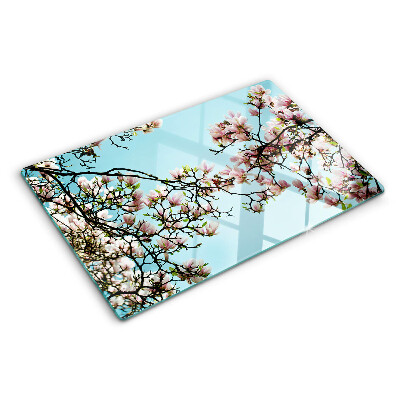 Planche à découper verre Fleurs de magnolia sur fond bleu