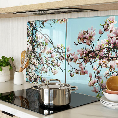 Planche à découper verre Fleurs de magnolia sur fond bleu