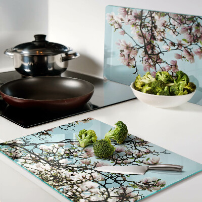 Planche à découper verre Fleurs de magnolia sur fond bleu