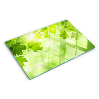Planche à découper en verre Feuilles aux rayons du soleil