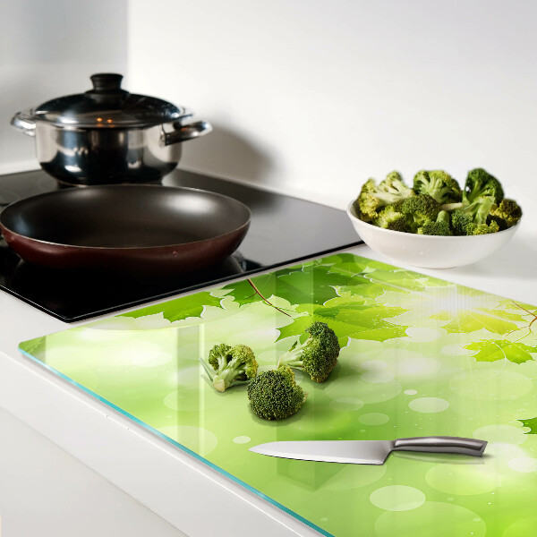 Planche à découper en verre Feuilles aux rayons du soleil
