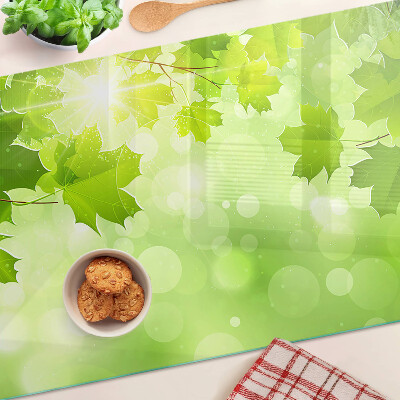 Planche à découper en verre Feuilles aux rayons du soleil