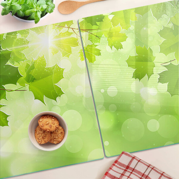 Planche à découper en verre Feuilles aux rayons du soleil