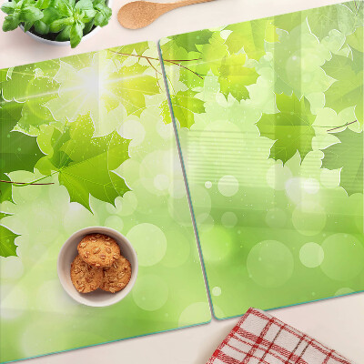 Planche à découper en verre Feuilles aux rayons du soleil