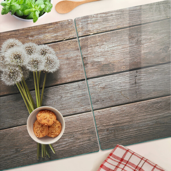 Planche à découper en verre Fleurs de pissenlit sur fond de bois