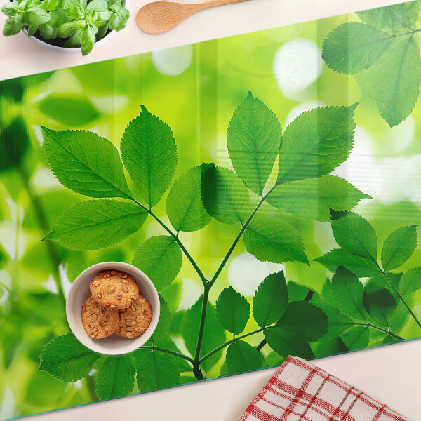 Planche à découper verre Feuilles sur fond vert