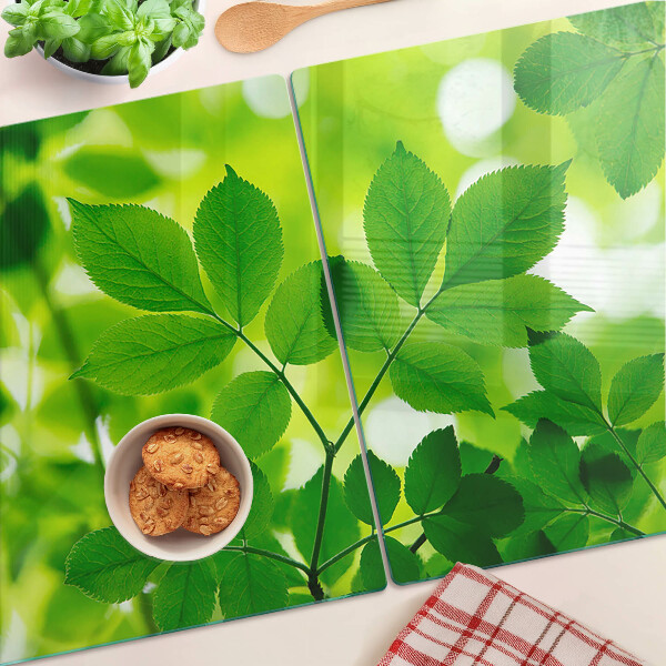 Planche à découper verre Feuilles sur fond vert