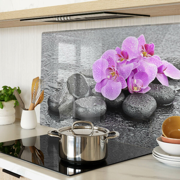 Planche à découper verre Fleurs et pierres sur fond d'eau