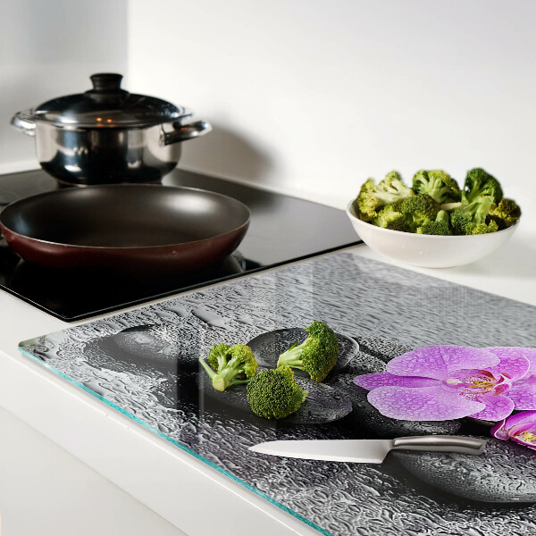 Planche à découper verre Fleurs et pierres sur fond d'eau