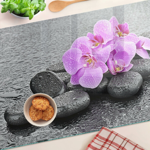 Planche à découper verre Fleurs et pierres sur fond d'eau
