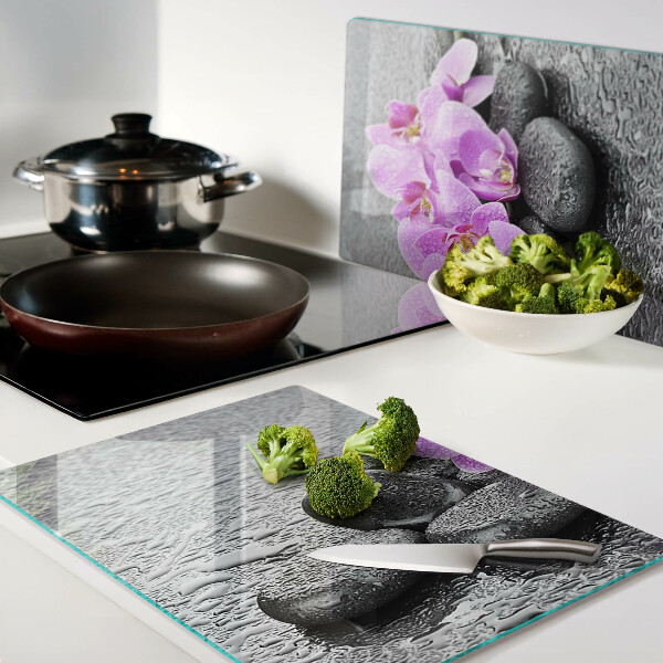 Planche à découper verre Fleurs et pierres sur fond d'eau